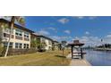 Exterior shot of a building with well-maintained landscaping and palm trees, taken on a sunny day at 4812 Jasper Dr Dr # 101, New Port Richey, FL 34652