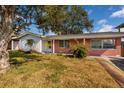 Charming single-story home with manicured lawn and red brick accents at 4837 97Th N Way, St Petersburg, FL 33708