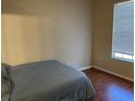 Bedroom with hardwood floors and a large window at 5125 Palm Springs Blvd # 11306, Tampa, FL 33647