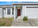 Inviting home entrance with a classic front door, showcasing a clean, well-maintained facade at 9117 Northcliffe Blvd, Spring Hill, FL 34606