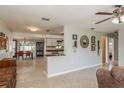 Open concept living space with dining area and stylish decor throughout at 932 Lexington Dr, Dunedin, FL 34698