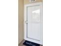 A welcoming white front door with 'welcome' doormat, unit number 3106, and neutral wall at 960 Starkey Rd # 3106, Largo, FL 33771