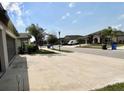 Neighborhood street view featuring well-maintained homes and landscaping at 10854 Sage Canyon Dr, Riverview, FL 33578