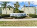 1301 SoHo community sign is surrounded by lush, manicured greenery at 1301 S Howard Ave # C10, Tampa, FL 33606