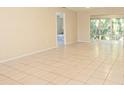 Tile flooring throughout the living room and views to the bedroom at 1433 S Belcher Rd # F11, Clearwater, FL 33764