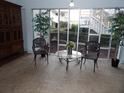 Well-lit lobby featuring seating, plants, and a clear view of the landscaped exterior at 2623 Seville Blvd # 111, Clearwater, FL 33764