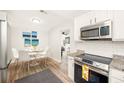 Bright dining area with modern decor and views into other living spaces at 2829 9Th W Ave, Bradenton, FL 34205