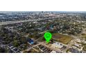 Aerial view of the neighborhood and surrounding landscape with the city in the background at 2912 N 29Th St, Tampa, FL 33605