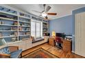 Home office features built-in bookshelves, desk and lots of natural light at 304 Silver Falls Dr, Apollo Beach, FL 33572