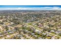 Panoramic aerial view of a residential area, featuring an array of homes, green spaces, and orderly street patterns at 3124 61St N Ln, St Petersburg, FL 33710