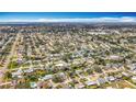 Expansive aerial view showcasing a well-planned residential neighborhood with lush greenery and diverse housing styles at 3124 61St N Ln, St Petersburg, FL 33710