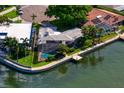 Aerial view of the property featuring a screened-in pool, dock, and waterfront access at 4464 46Th S Ave, St Petersburg, FL 33711