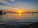 Beautiful sunset over the water reflecting the bright orange sky and the calm water at 4464 46Th S Ave, St Petersburg, FL 33711