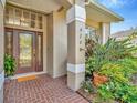 The front entrance features a beautiful brick floor and a newer model front door at 6208 Forrestal Dr, Tampa, FL 33625