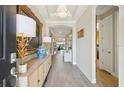 Spacious foyer with elegant lighting, tile flooring, and decorative accents creating a welcoming entrance at 624 Maraviya Blvd, Nokomis, FL 34275