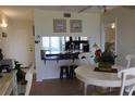 Open dining area with counter seating flows into the kitchen, perfect for casual meals at 6287 Bahia Del Mar Cir # 101, St Petersburg, FL 33715