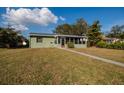 Inviting single-story home with a cozy front porch, perfect for relaxing outdoors at 775 40Th Ne Ave, St Petersburg, FL 33703