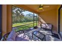 Relaxing screened lanai with comfortable seating overlooking a private backyard at 320 Seneca Falls Dr, Apollo Beach, FL 33572