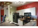 Functional kitchen area with modern appliances, bright white cabinets and stylish decor at 4323 Bayside Village Dr # 314, Tampa, FL 33615