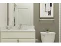 Elegant bathroom with a stone countertop vanity and modern toilet, complemented by stylish wall decor at 6857 E 115Th St, Palmetto, FL 34221