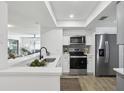 Modern kitchen features stainless steel appliances and open concept design at 2725 Countryside Blvd # 103, Clearwater, FL 33761