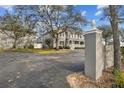 View of the townhouse complex with well-maintained landscaping and mature trees giving a community feel at 4927 Elizabeth Anne Cir, Tampa, FL 33616