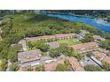 Aerial view of the community showcases lush landscaping and a sparkling pool at 4965 Puritan Cir # 401, Tampa, FL 33617