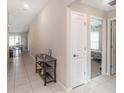 Hallway featuring neutral walls and tile flooring at 5446 Blue Azure Dr, Wimauma, FL 33598