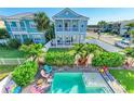 Aerial view of a home with a private pool, lush landscaping, and a fenced backyard at 6571 Simone Shores Cir, Apollo Beach, FL 33572