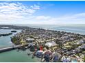 Aerial view showcases the waterfront property's location with quick access to beaches, waterways and St. Pete at 1201 Bay Dr, Belleair Beach, FL 33786
