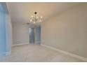 Bright dining room featuring tile floors and a modern light fixture at 20092 Stone Pine Cir, Lutz, FL 33558