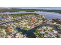 Aerial view of waterfront homes showing water access to the ocean at 2031 Tanglewood Ne Way, St Petersburg, FL 33702