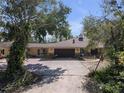 A charming single story home with a large driveway and attached two car garage at 3112 Desoto Rd, Sarasota, FL 34234