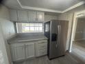Modern kitchen features stainless steel appliances, granite countertops, and ample cabinet space at 3320 Jackson Dr, Holiday, FL 34691