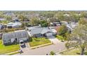 Aerial view of a suburban home with a well-kept lawn and a two-car garage at 6268 105Th N Ter, Pinellas Park, FL 33782