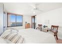 Light and airy main bedroom with beautiful views from the large window and attached balcony at 9425 Blind Pass Rd # 506, St Pete Beach, FL 33706