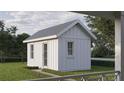 Back view of a shed-style home, boasting white siding and a well-maintained lawn with pathway at 1000 46Th N Ave, St Petersburg, FL 33703