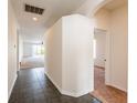 Inviting entryway with tile flooring, flowing into carpeted living spaces, and showcasing arched doorways at 11116 Rodeo Ln, Riverview, FL 33579