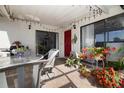 Cozy outdoor patio with stylish furniture, string lights, and vibrant potted plants at 14511 Catalina Cir # 14511, Seminole, FL 33776