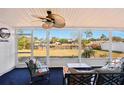 Enclosed patio featuring comfortable seating and scenic views of the surrounding landscape at 18350 Burkholder Cir, Port Charlotte, FL 33948