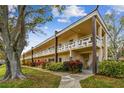 Inviting condo building featuring charming architectural details, perfect for comfortable living at 2280 World Parkway Blvd # 34, Clearwater, FL 33763