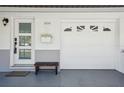 Front entrance showcases brick facade, attached garage, and inviting entry door at 2851 66Th N Way, St Petersburg, FL 33710