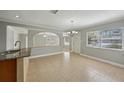 Spacious dining area featuring an open layout, tile flooring, and ample natural light at 4101 W Leila Ave, Tampa, FL 33616