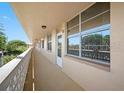 Long exterior corridor with multiple windows and entrances to condos at 4915 Bay Ne St # 322, St Petersburg, FL 33703