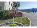 Welcome to the Avalon sign, showcasing lush landscaping, community address and views of the marina at 5840 30Th S Ave # 208, Gulfport, FL 33707