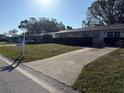 Charming single story home with a well manicured lawn and an extended driveway, perfect for multiple vehicles at 11470 88Th Ter, Seminole, FL 33772