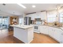 Spacious kitchen with stainless steel appliances, island, and dining area at 36645 Kay Ave, Zephyrhills, FL 33542