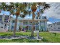 Building facade shows an exterior with pristine landscaping and shade trees at 4400 37Th S St # 3, St Petersburg, FL 33711