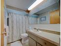 Cozy bathroom with a shower and bathtub combination and vanity at 5313 Baroque Dr, Holiday, FL 34690