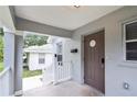 Home featuring a welcoming covered front porch and exterior door at 701 15Th S Ave, St Petersburg, FL 33701